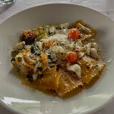 Lucia's on the Lake signature dishes Lobster RavioliSeafood Fra DiavoloVeal LuciaChicken Milanese